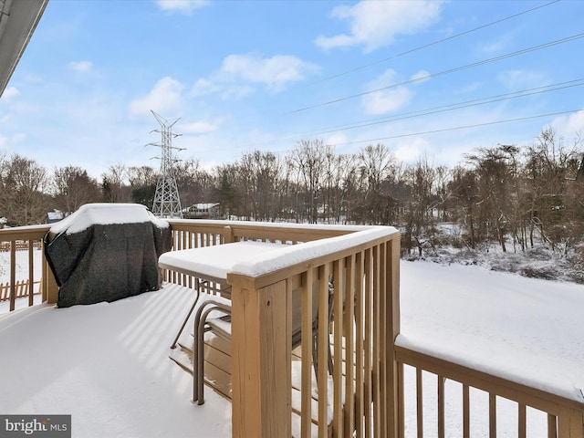 view of snow covered deck