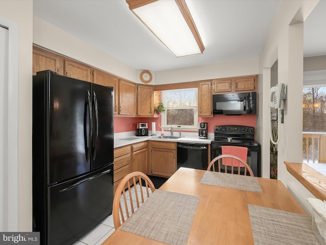 kitchen featuring sink and black appliances