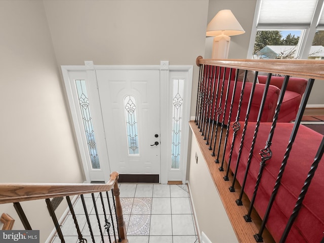 foyer entrance with light tile patterned floors