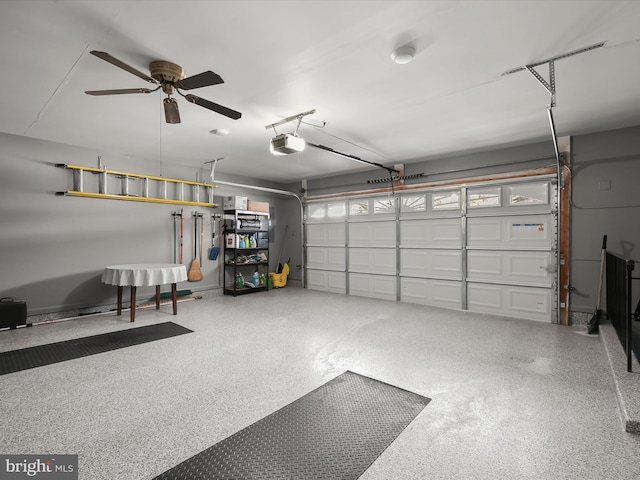 garage with a garage door opener and ceiling fan