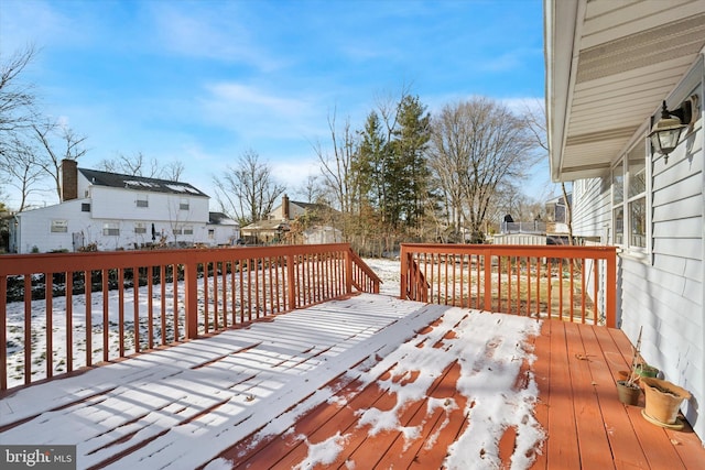 view of snow covered deck