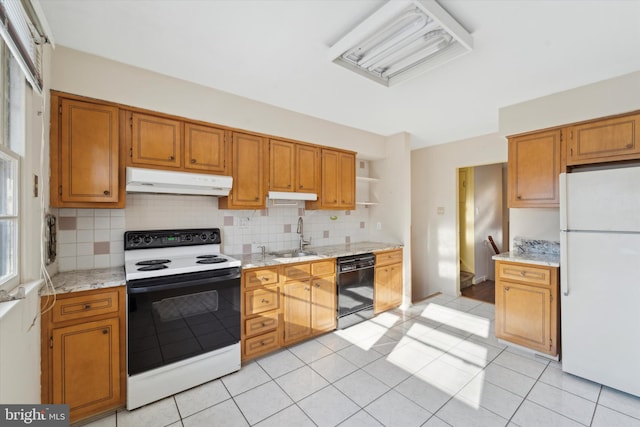 kitchen featuring electric stove, white refrigerator, decorative backsplash, sink, and black dishwasher