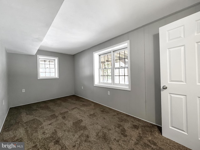 carpeted spare room with plenty of natural light