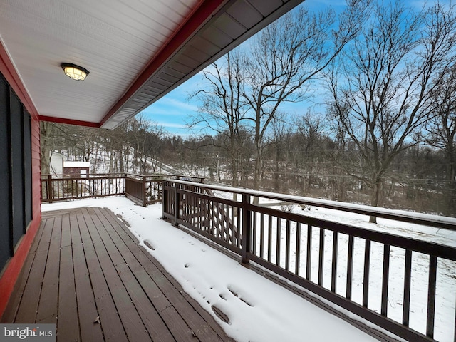 view of snow covered deck