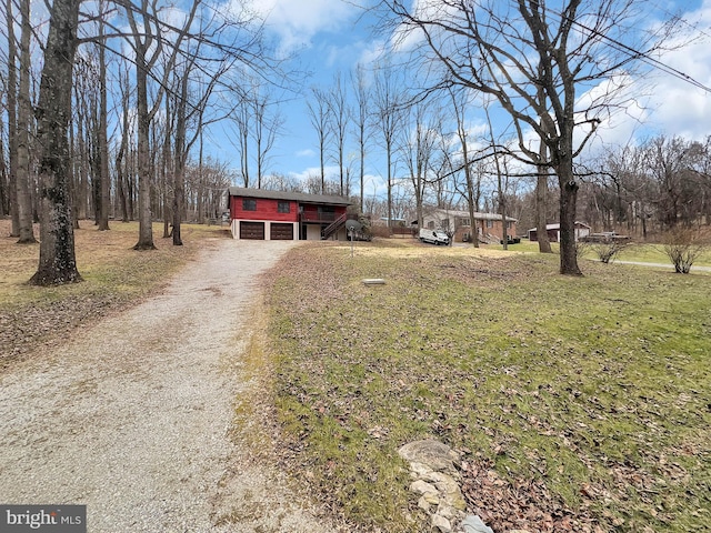 view of front of house featuring a garage and a front yard