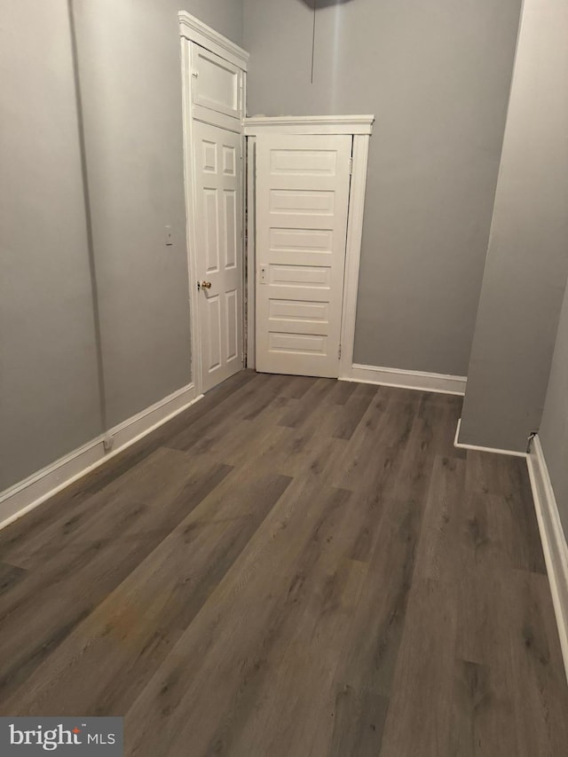 hallway featuring dark hardwood / wood-style floors