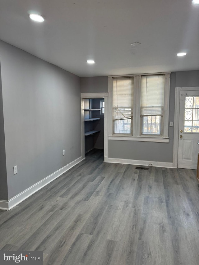 unfurnished living room featuring hardwood / wood-style floors