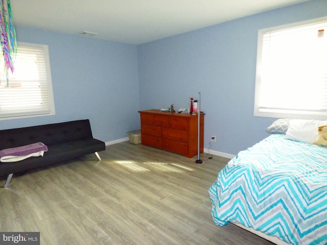 bedroom with light hardwood / wood-style flooring