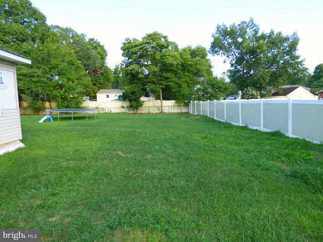 view of yard featuring a trampoline