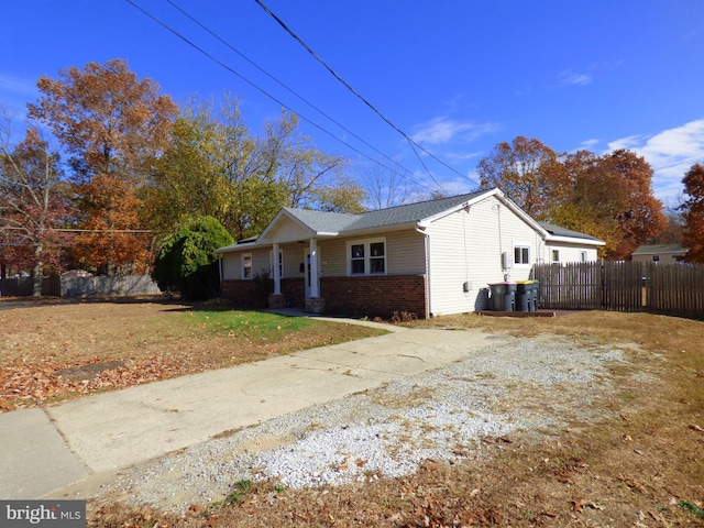 view of side of home featuring a lawn