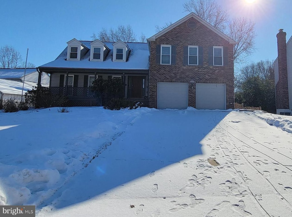 view of front of house featuring a garage and covered porch