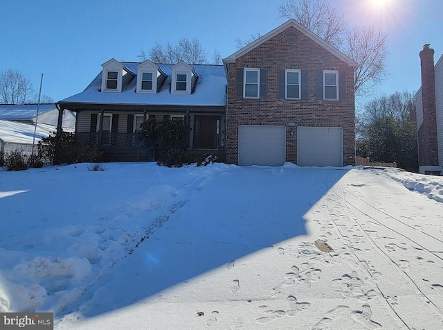 view of front of house featuring a garage and covered porch