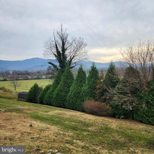 mountain view featuring a rural view