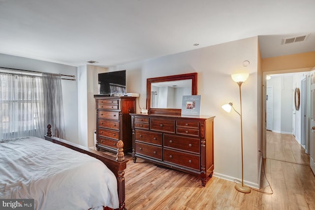 bedroom with light hardwood / wood-style flooring