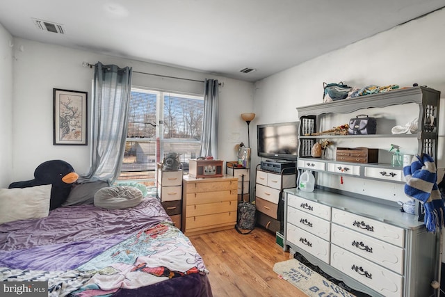 bedroom with light wood-type flooring