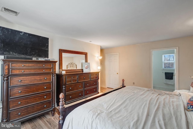 bedroom with light hardwood / wood-style floors