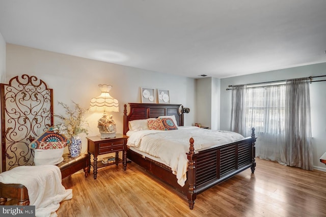 bedroom with light hardwood / wood-style flooring