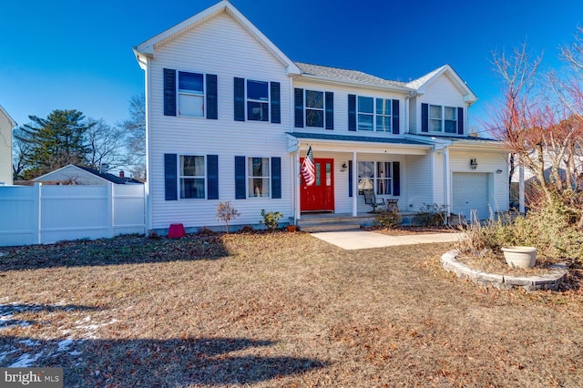 view of front of property featuring a porch and a garage