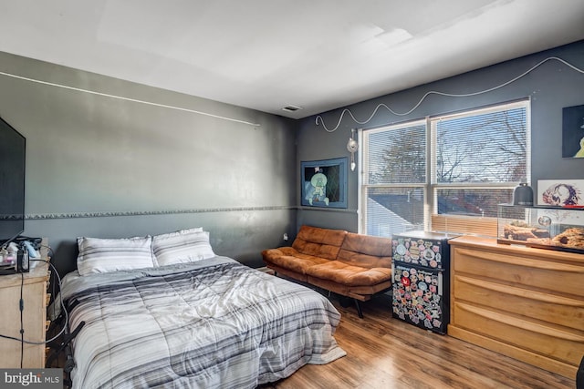 bedroom featuring wood-type flooring