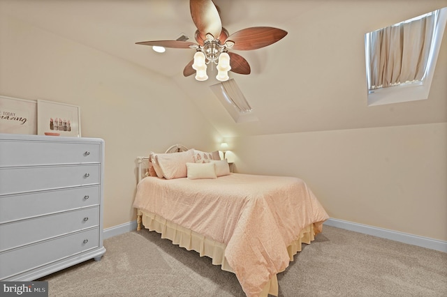 carpeted bedroom featuring ceiling fan and vaulted ceiling