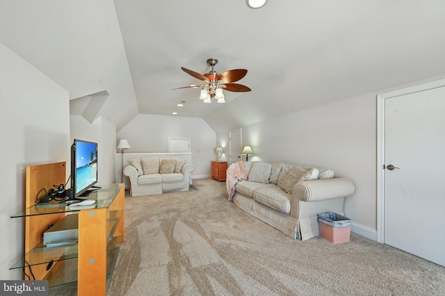 living room with ceiling fan, carpet, and lofted ceiling