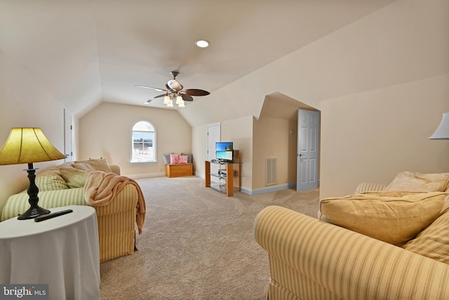 living room with lofted ceiling, light colored carpet, and ceiling fan