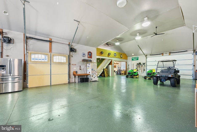 garage with stainless steel fridge with ice dispenser