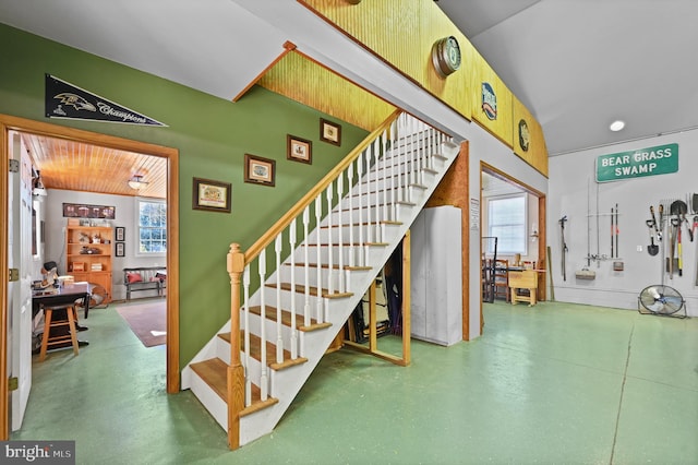 stairway featuring a wealth of natural light