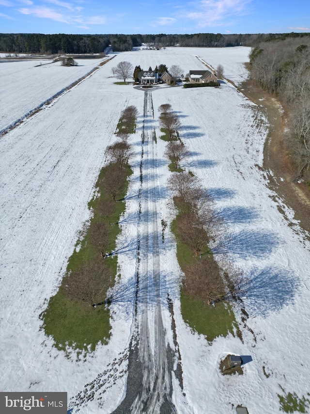 snowy aerial view with a rural view