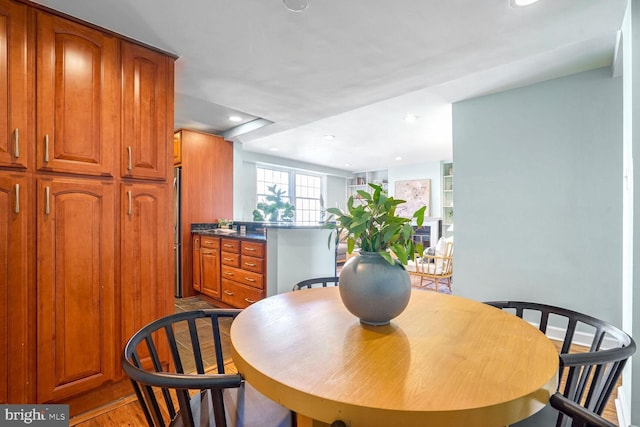 dining space with light hardwood / wood-style flooring