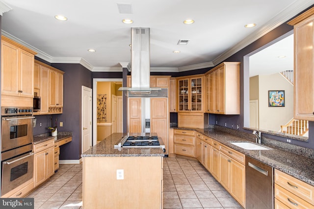 kitchen with visible vents, light brown cabinets, island range hood, stainless steel appliances, and a sink