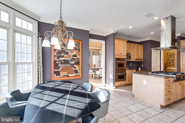 kitchen with island exhaust hood, stainless steel appliances, a chandelier, and light brown cabinets