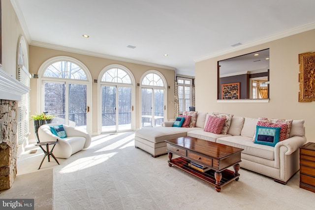 living area featuring a wealth of natural light, recessed lighting, and ornamental molding