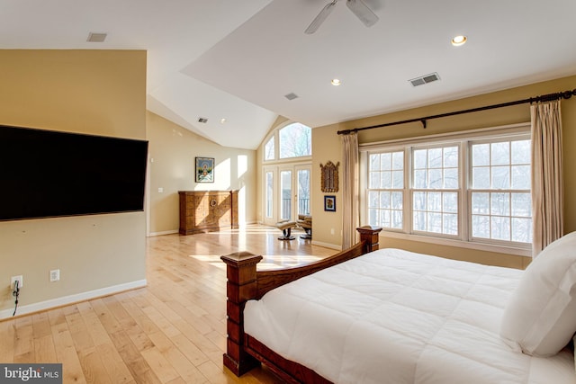 bedroom featuring hardwood / wood-style floors, visible vents, baseboards, lofted ceiling, and recessed lighting