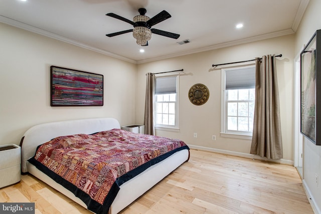 bedroom featuring visible vents, ornamental molding, wood finished floors, recessed lighting, and baseboards