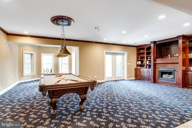 playroom with a healthy amount of sunlight, a large fireplace, and carpet floors