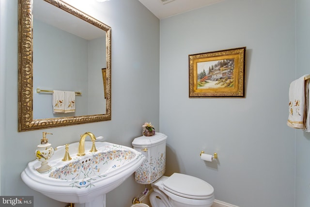 bathroom with a sink and toilet