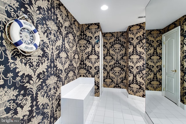 full bathroom with visible vents, a bath, tile patterned flooring, and wallpapered walls