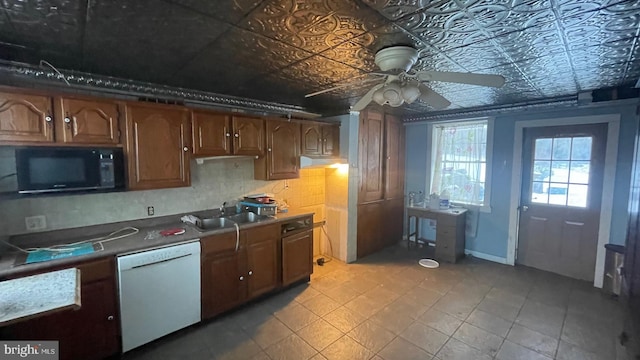 kitchen with white dishwasher, ceiling fan, and sink