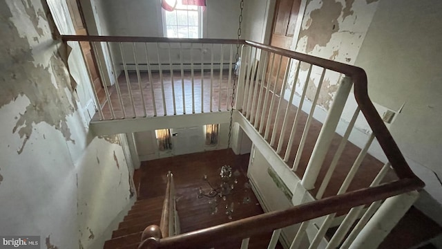 stairway with a baseboard radiator