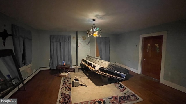 dining area with a chandelier and dark hardwood / wood-style floors