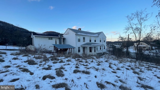 view of snow covered property