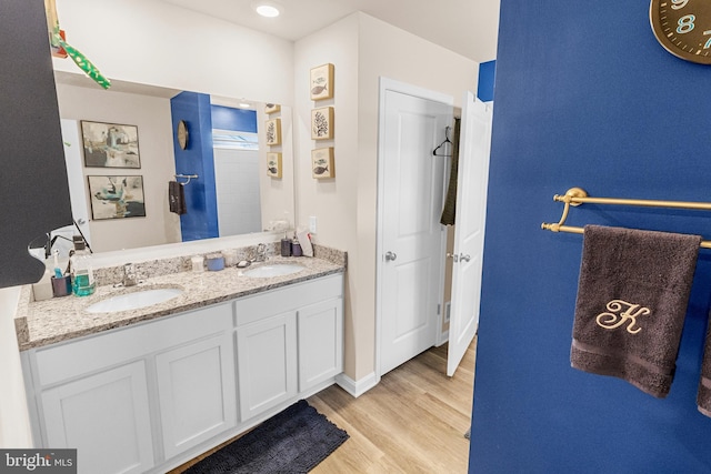 bathroom featuring vanity and hardwood / wood-style flooring