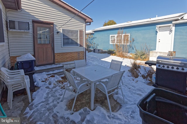 view of snow covered patio