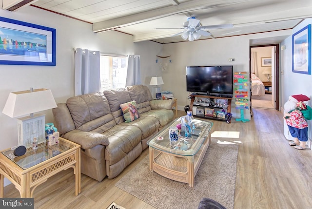 living room featuring beam ceiling, ceiling fan, and light hardwood / wood-style flooring