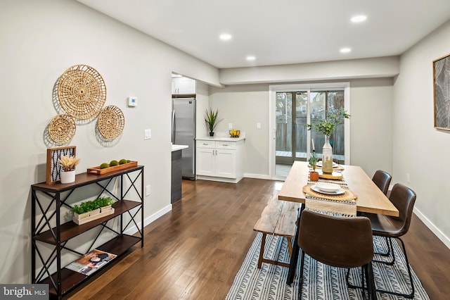 dining area with dark hardwood / wood-style floors