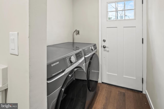 washroom featuring dark hardwood / wood-style flooring and separate washer and dryer