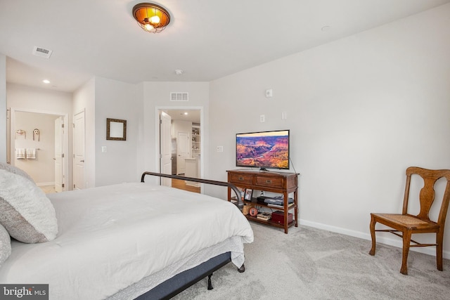 bedroom featuring light colored carpet