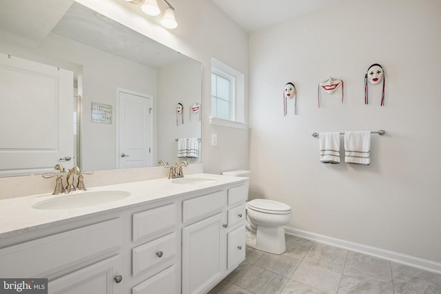 bathroom with toilet and vanity