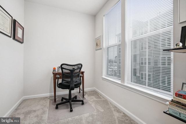 office space featuring light colored carpet